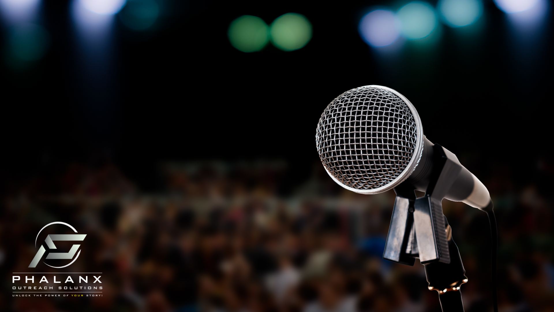 Close-up of a microphone on stage, with the Phalanx Outreach Solutions logo in the lower left corner. The tagline reads: "Unlock the Power of Your Story!"