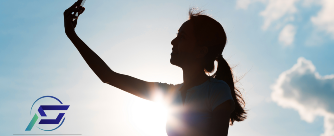 Silhouette of a woman taking a selfie photo - User Generated Content